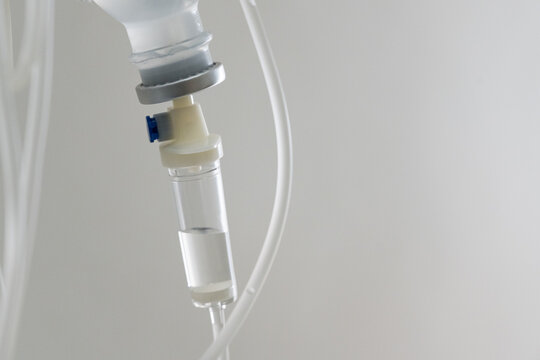 Close up set iv fluid intravenous drop saline drip for accident and seriously patient in hospital room.Medical treatment emergency patient.Medical treatment and cure concept.