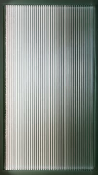 Abstract fluted glass field with vertical ribs and a mint color palette, featuring a smooth frosted texture for phone wallpapers and app backgrounds