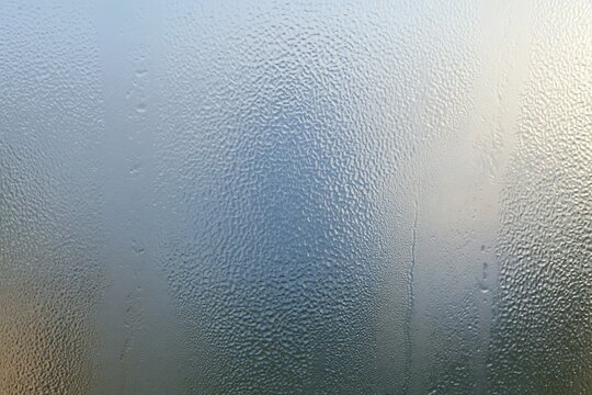 Frosted glass texture with a dimpled translucent surface, featuring cool lavender and periwinkle blue tones for backgrounds and design overlays
