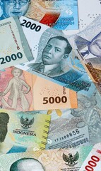 Indonesian rupiah money bills in pile on table. Indonesia IDR currency cash close up © Viktor