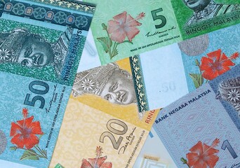 Malaysian ringgit money bills in pile on table. Malaysia MYR currency cash close up © Viktor