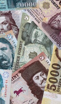 Hungarian forint money bills in pile on table. Hungary HUF currency cash close up
