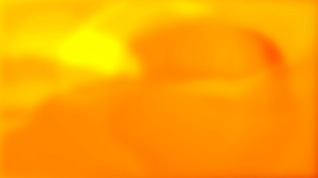 Abstract yellow and orange gradient background with soft glowing light effects and vibrant warm sunset colors texture