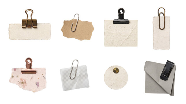 Collection of blank vintage paper scraps memo notes and tags with metal clips and pins isolated on white background