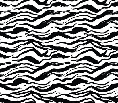 Black and white zebra striped seamless pattern with artistic brush style.