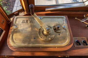 Vintage tram brass controller handle and wooden dashboard © smoku7979