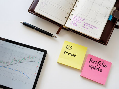 Organized workspace with q3 review and portfolio update