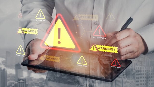Business professional using digital tablet with warning alerts and security notifications in a modern urban environment for cybersecurity issues and risks Gluon.
