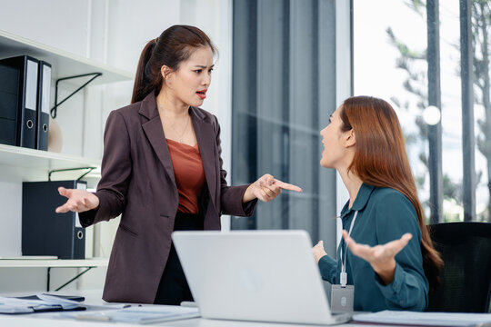 Professional businesswomen colleagues intense argument workplace