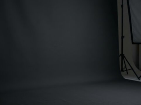 Dark gray studio backdrop with empty wide area