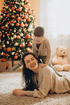 Mother and child playing during christmas holidays