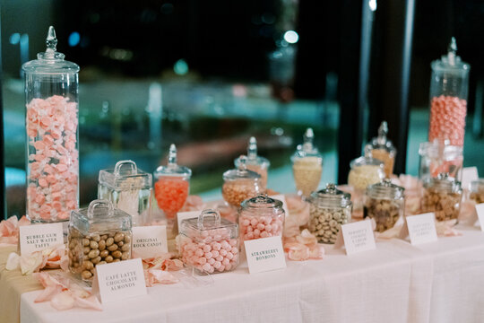 Elegant Candy Buffet Table with Glass Jars and Assorted Sweets