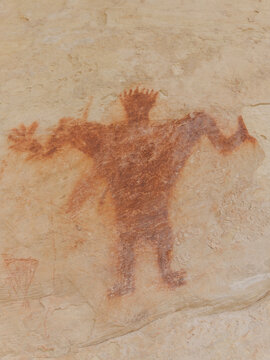 View of an ancient anthropomorphic pictograph painted on a sandstone rock surface in Moffat County, Colorado, United States.