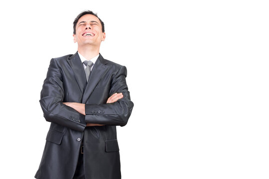 Positive male in formal suit laughing with closed eyes with crossed arms