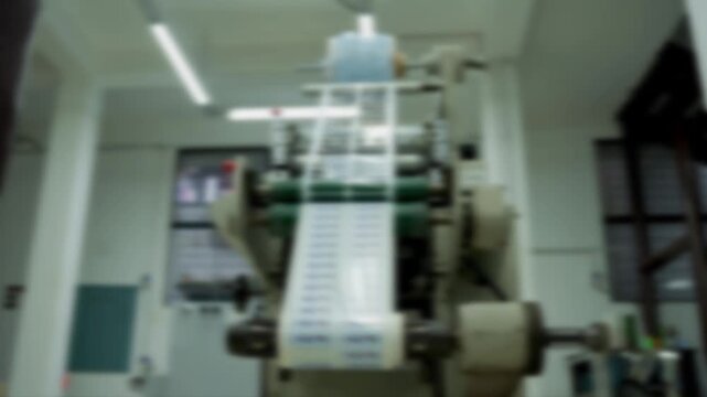 Abstract Blur of Label Die Cutting Machine, Abstract Industrial Background With Blurred Machine
