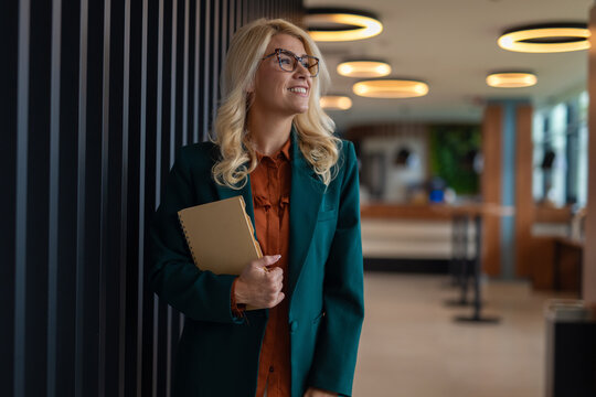 Professional woman smiling looking away in office