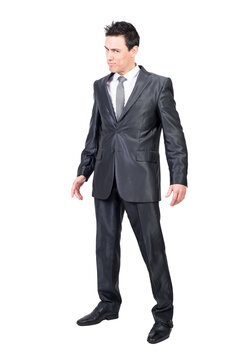 Full body of handsome male in formal outfit looking at camera with seductive face expression isolated on transparent background