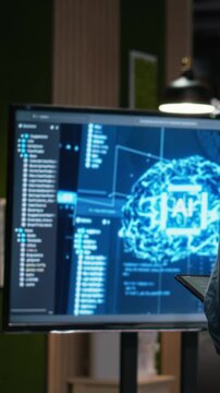 Man works on artificial intelligence in modern office