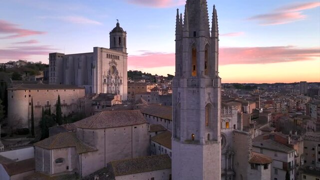Girona at Sunset time, Aerial Shot. Fly over the Historical Center with Colorful Houses and Cathedral of Girona, Spain.
