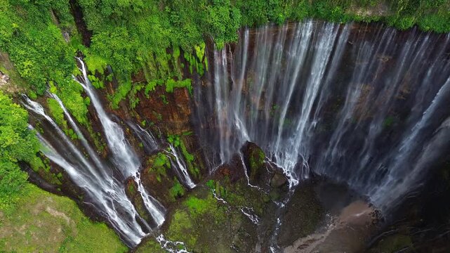 Aerial Panning Shot of Tumpak Sewu Waterfall Cascades