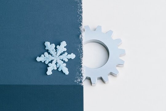 Snowflakes and a steel gear aligned in a split frame, featuring frosty ice and polished metal textures for engineering and winter tech