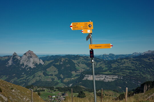 Yellow Hiking Signpost on Stoos Ridge in Switzerland