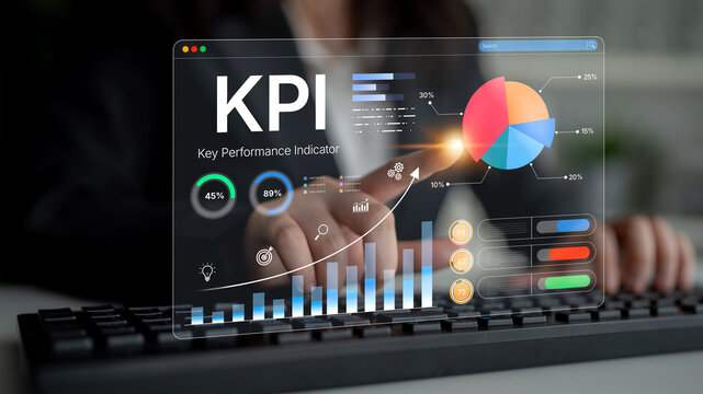 Business professional analyzing key performance indicators on a futuristic touchscreen interface with graphs and charts displaying performance metrics. Bitwise.