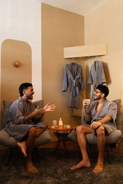Two Men Relaxing in Bathrobes at Luxury Wellness Spa