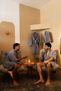 Two Men Relaxing in Bathrobes at Luxury Wellness Spa