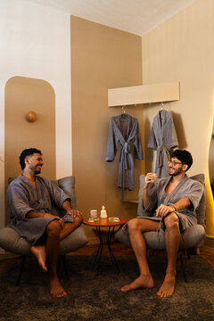 Two Men Relaxing in Bathrobes at Luxury Wellness Spa