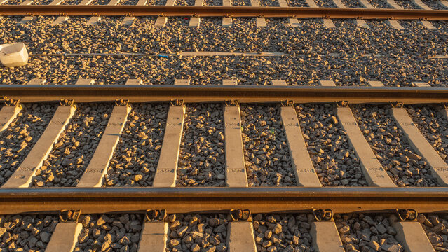 Close-up of railway tracks converging into distance