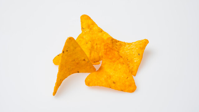Tortilla chips with dip sauce on white background