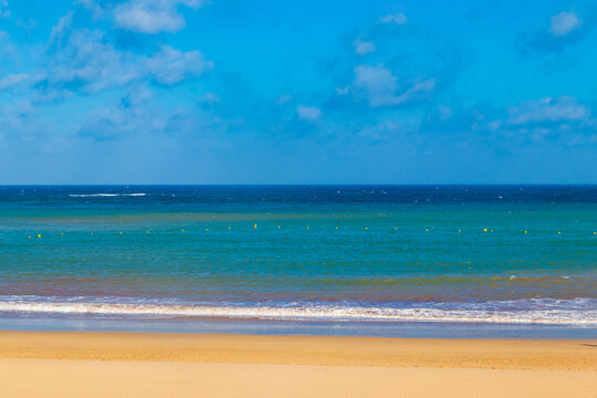 View of a beautiful sandy beach of the Atlantic Ocean in Costa Teguise, Lanzarote, Canary Islands, Spain