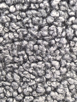 Close-up view of soft gray fabric with a textured, fluffy surface