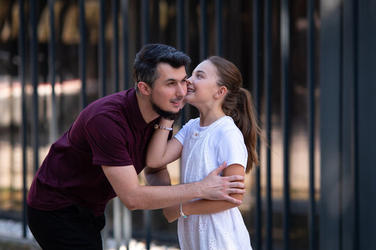 Father and daughter bonding, child whispering a secret to dad in a city, family connection and trust, Authentic interaction between parent and child