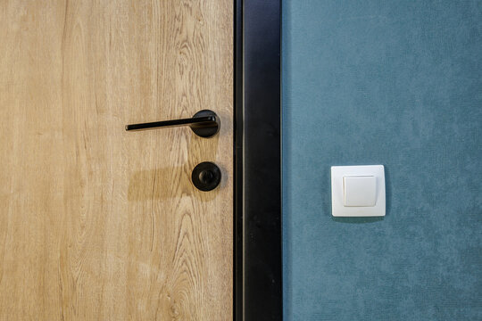 door handle on white wooden door in interior. Knob close-up elements. Door handle, fittings for interior design