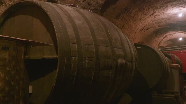 Wine barrels aging in a traditional cellar