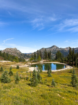 View from Naches Peak loop trail of an isolated alpine lake in the Chinook Pass area of Mount Rainier National Park.