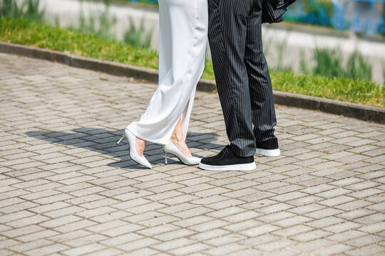 groom embraces the bride with wedding bouquet. rings on the hands of newly-married couple. bride put her hands on the shoulders of the bridegroom.