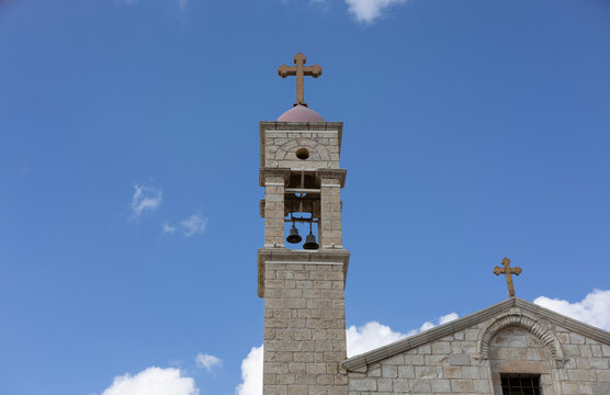 Architectural details, stone walls, bell tower, and cross of the Greek Orthodox Church of the Annunciation (Church of St. Gabriel) in Nazareth, Israel