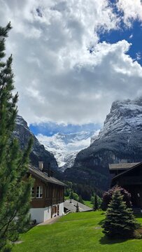  Swiss Alps Mountain Village with Traditional Chalet and Glacier View, Grindelwald, Switzerland