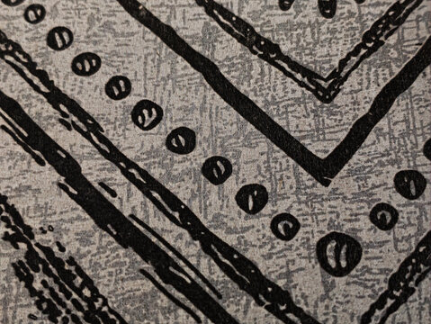 Abstract Black Tribal Geometric Pattern on Gray Fabric Texture Background