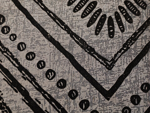 Abstract Black Tribal Geometric Pattern on Gray Fabric Texture Background