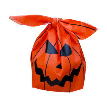 Orange plastic goody bag printed with a classic black jack-o'-lantern face, tied tightly at the top with handles, halloween treat bag, pumpkin bag, goody bag, trick or treat, gift bag, party bag