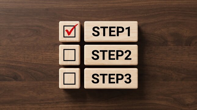 Wooden blocks indicating three step-by-step process with step one completed with a red checkmark symbol on dark wooden background, conceptualizing milestone, goal planning and progress