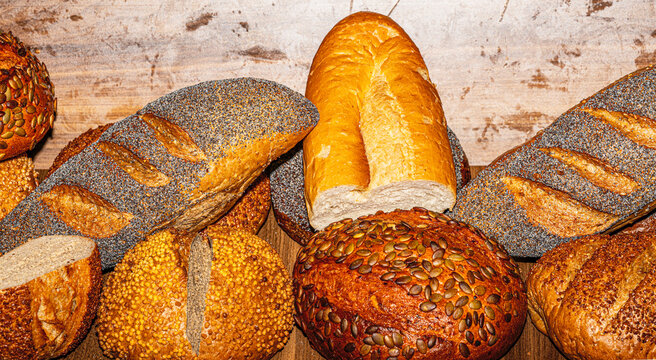 Wide selection of freshly baked bread loaves and rolls at a luxury hotel open buffet breakfast.