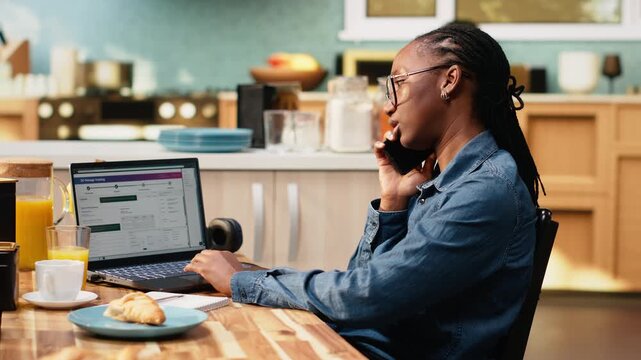 Black woman does customer service call for package tracking verification, solving transport issue with real time updates and shipment details. Checking delivery delay via tracking number.