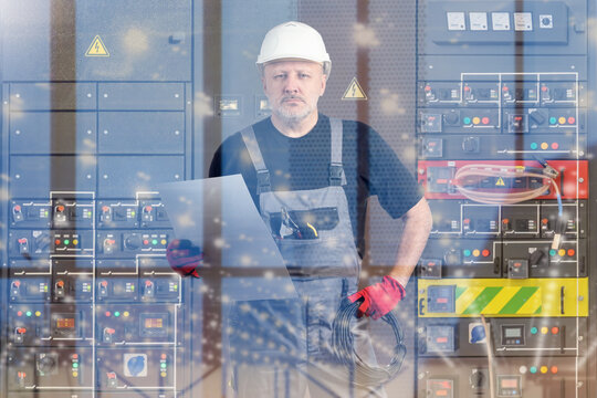 Electrical engineering, technician monitors control panels and analyzes system data on laptop. Industrial power equipment operation, safety inspection and maintenance in energy facility.