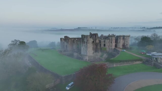 Raglan Castle in the fog at dawn, Monmouthshire, Wales, England, United Kingdom