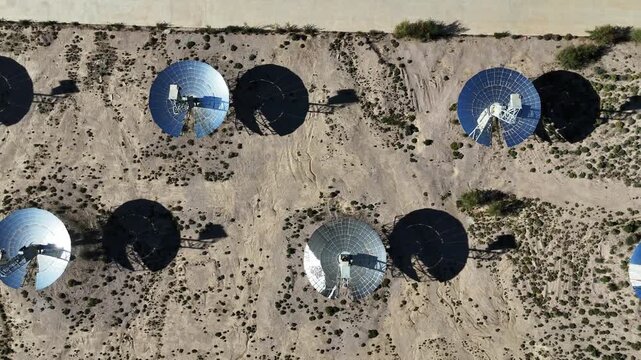 solar power satellite dish antennas in desert landscape
